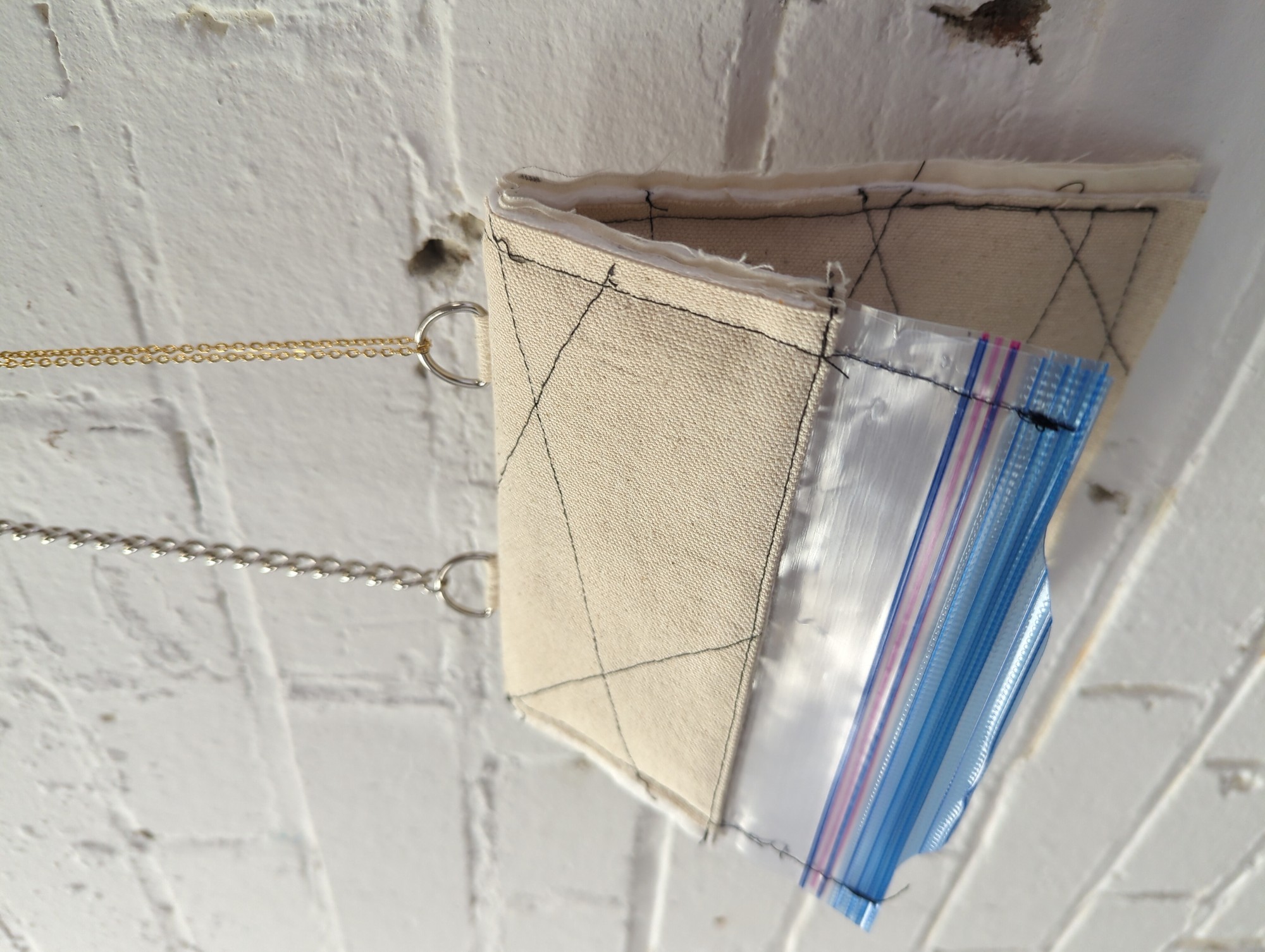 cotton quilted with thinsulate featuring zip lock closure bag