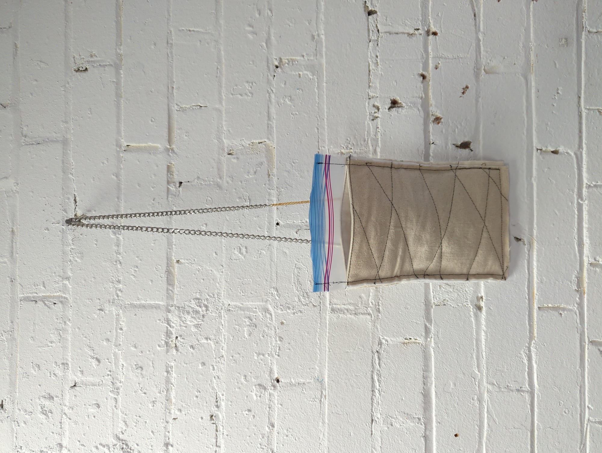 cotton quilted with thinsulate featuring zip lock closure bag